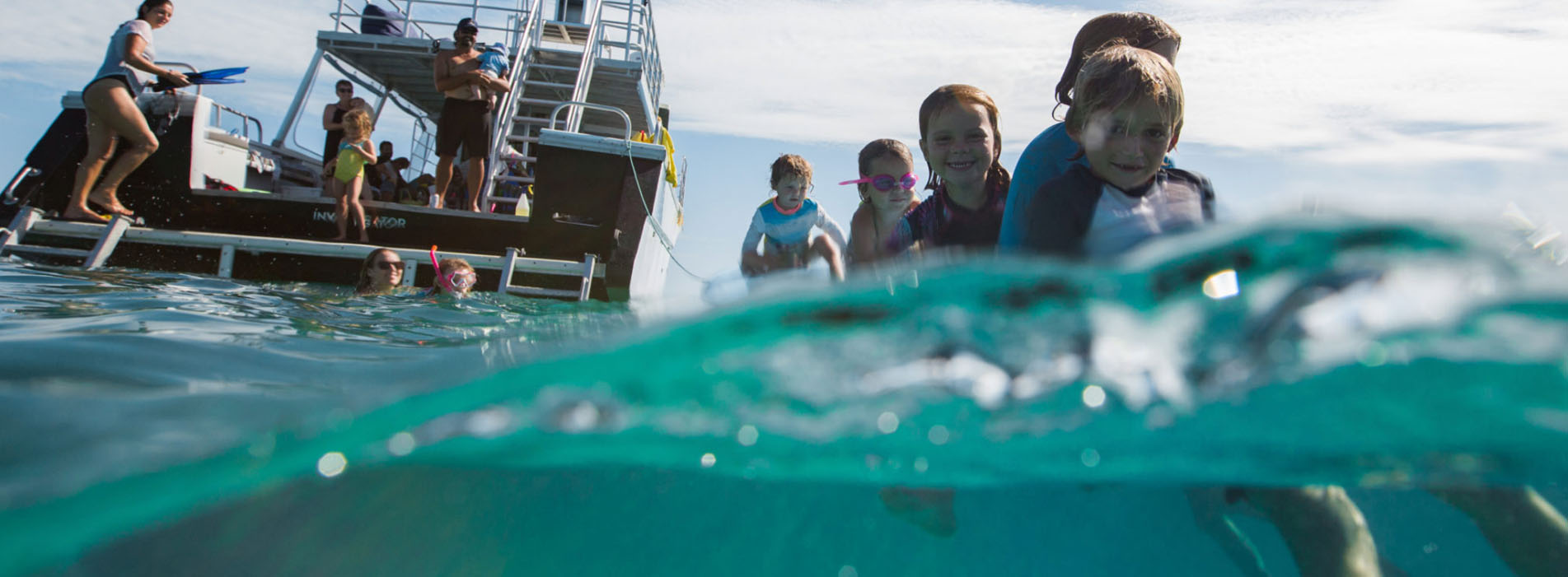 INVESTIGATOR kids in water whaleshark swim Exmouth Ningaloo